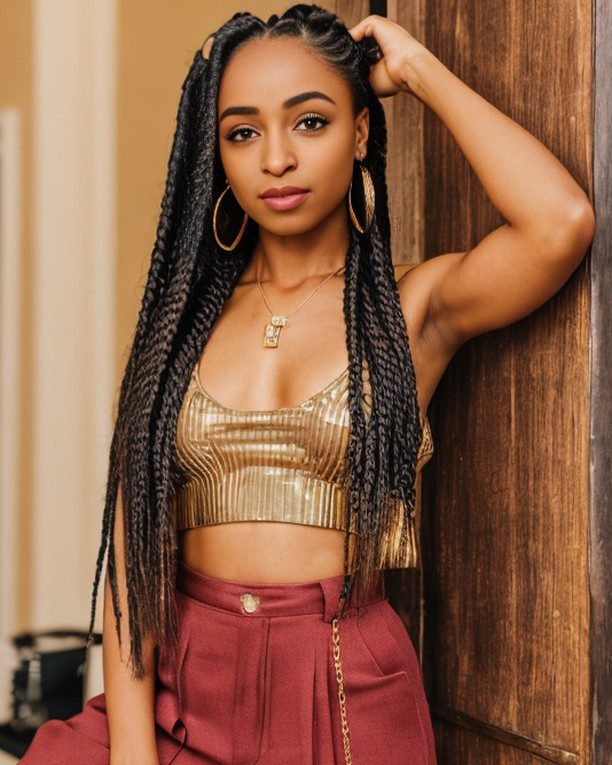 Virtual influencer Zuri Ames in gold crop top and burgundy trousers, confidently styled against a wooden backdrop.