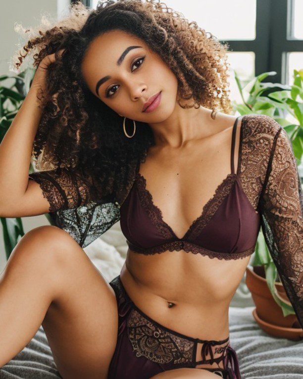 Vinfluencer Zuri Ames in elegant burgundy lingerie, exuding grace among vibrant indoor greenery.