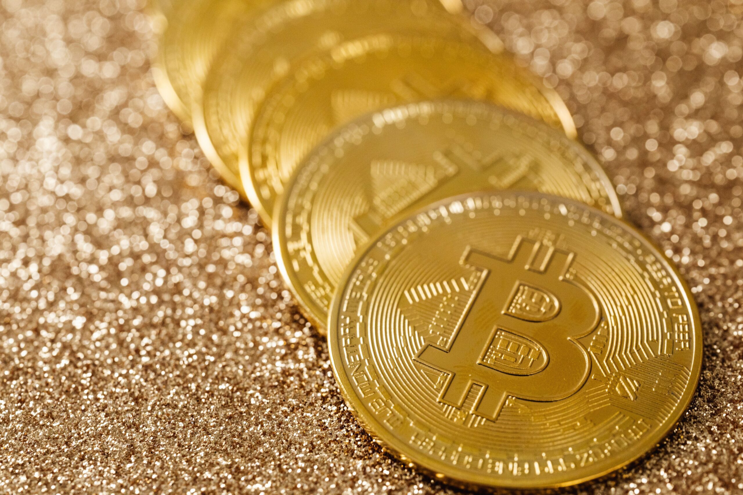 Bitcoin Halving history, golden coins on a dark surface