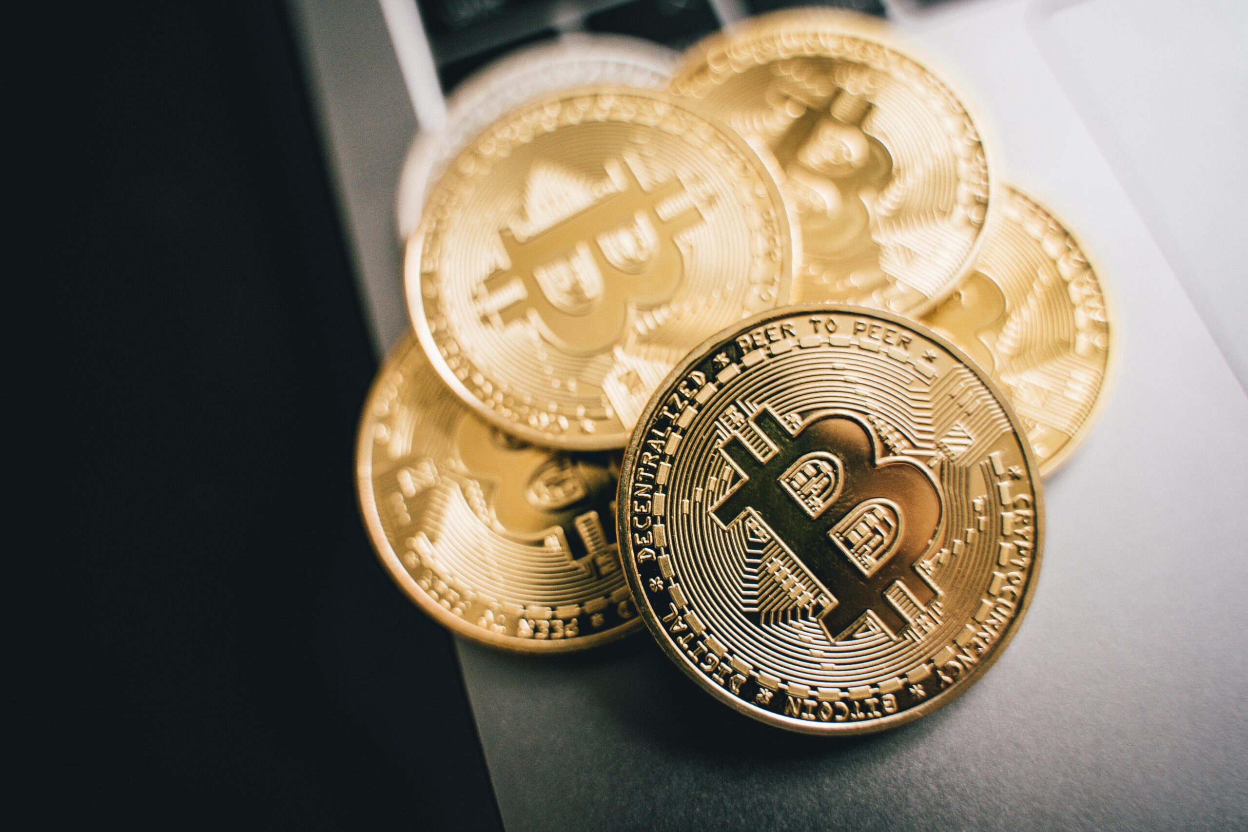 Gold bitcoins on a gray surface, dim monumental lighting, evoking a season of monetary fasting and the Bitcoin Halving as Lent
