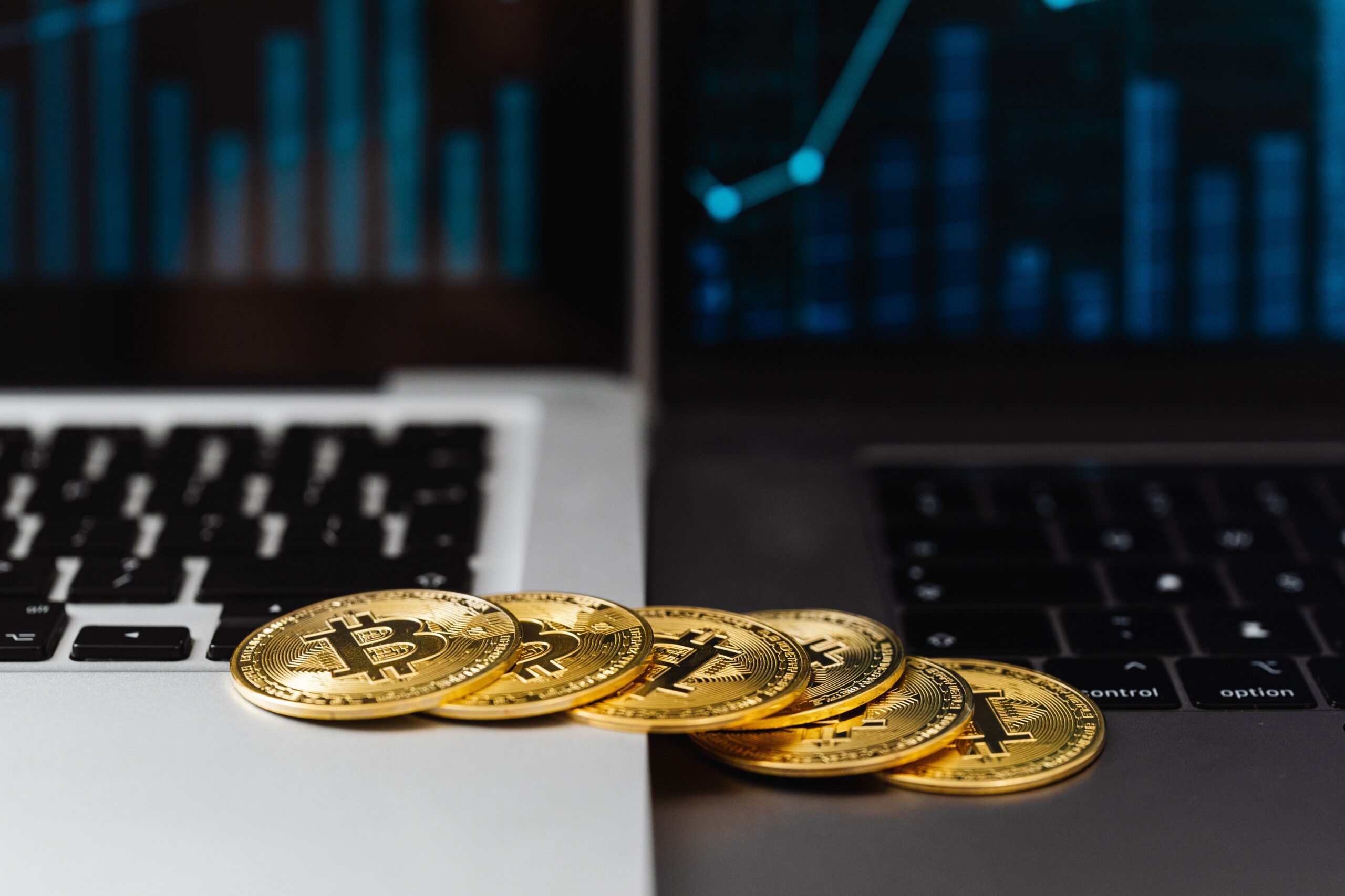 Close-up of bitcoin coins on a laptop, image for a Halfture sermon on the Genesis block headline